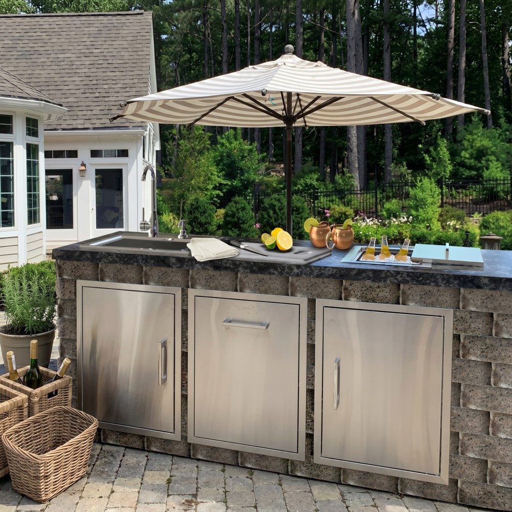 Patio bar — Bar island with sink, ice well, and full-height access doors.